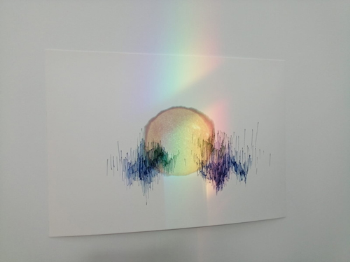 Sunlight in rainbow colours on set of drawings titled Radioastronomy (here comes the Sun) by Inês Rebelo