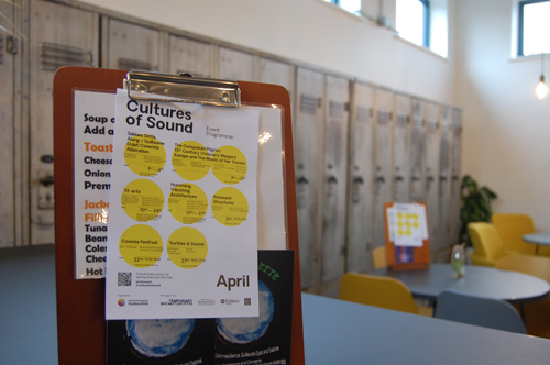 Detail from the Bath House Galleries' Café showing the leaflet from Cultures of Sound on a table